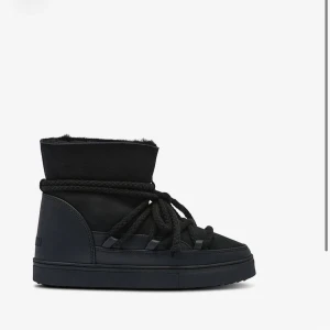 Svarta inuikii skor - Andvända