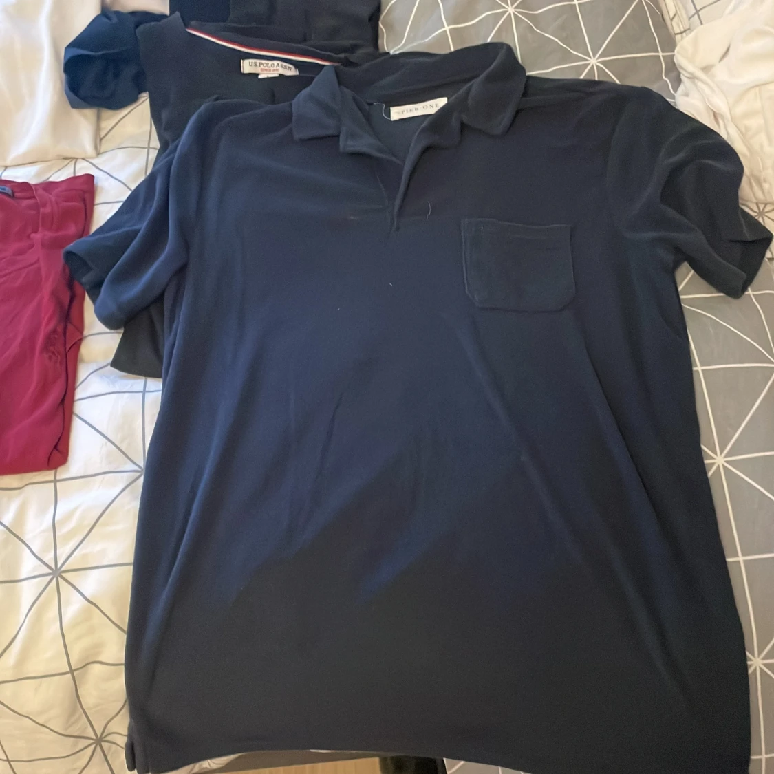 Mörkblå pikétröja från Pier One