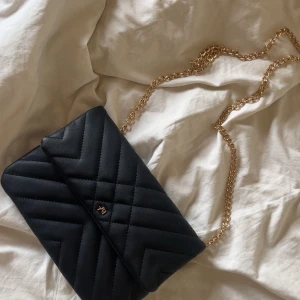 black small bag - small black bag with golden chain from anna field. condition is great. the measurements are 25cm x 19cm