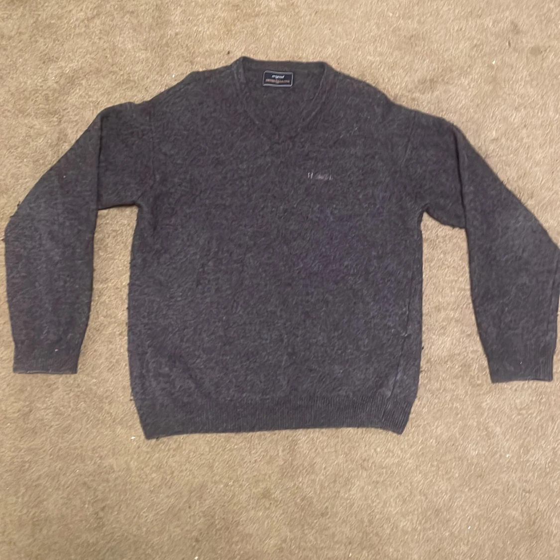 Mörkgrå ulltröja från Henri Lloyd