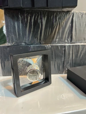 Elegant Jewelry Boxes – 75 Pieces - Stylish black jewelry boxes, perfect for rings, earrings, and small jewelry. Brand new and plastic wrapped for a premium look.  Each box has two parts with an elastic holder that keeps jewelry secure and fits different sizes, as shown in the picture.  ✔️ 75 pieces ✔️ Black color ✔️ Brand new, sealed ✔️ Flexible elastic holder ✔️ Ideal for gifts, retail, or storage  Elegant, practical, and professional 