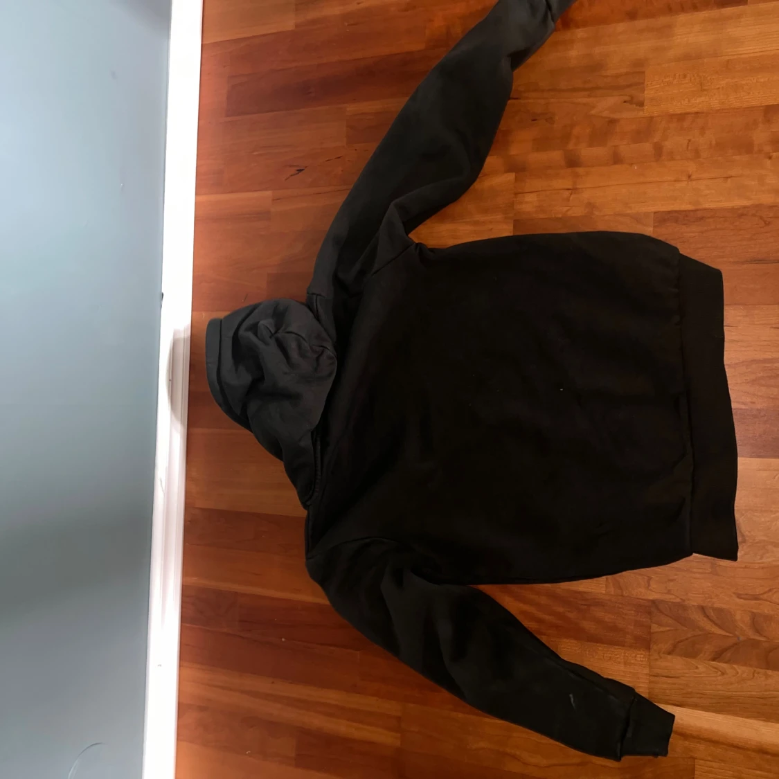 Mörk grön hoodie från Peak Performance - 1