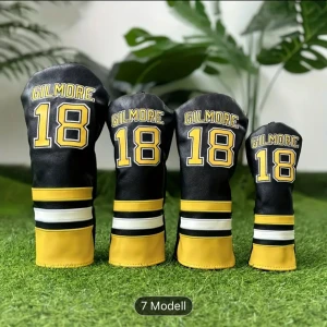 Svarta och gula headcover Gilmore 18 - Säljer ett set svarta och gula hardcovermed texten 'GILMORE' och siffran 18 i gult och vitt. Handskarna har sportig look med breda ränder i gult, vitt och svart nedtill. Perfekta för dig som gillar sportig stil och vill sticka ut på golfbanan.