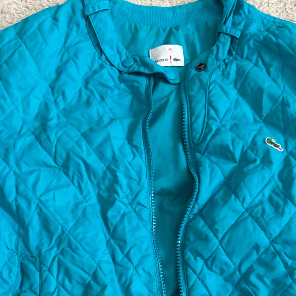 Turkos quiltad bomberjacka Lacoste - 1