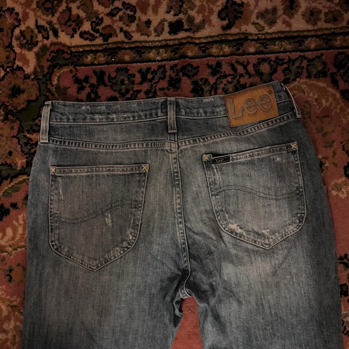 Ljusblå slitna jeans från Lee 30/32 - 3