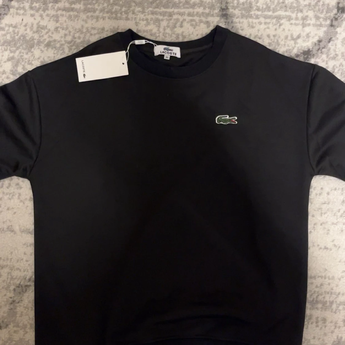Svart sweatshirt från Lacoste