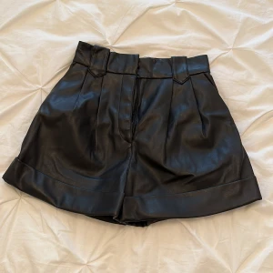 Black faux leather shorts - Love them But unfortunately don’t have a back  to fill them out :/ 
