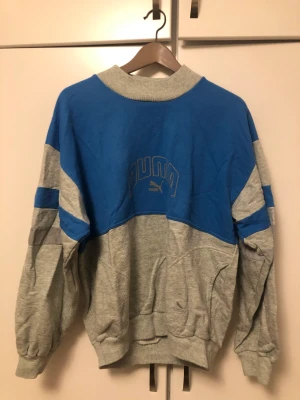 Vintage Puma-tröja med inbyggd relex  - Vintage Puma tröja i storlek M med reflex på ärmarna