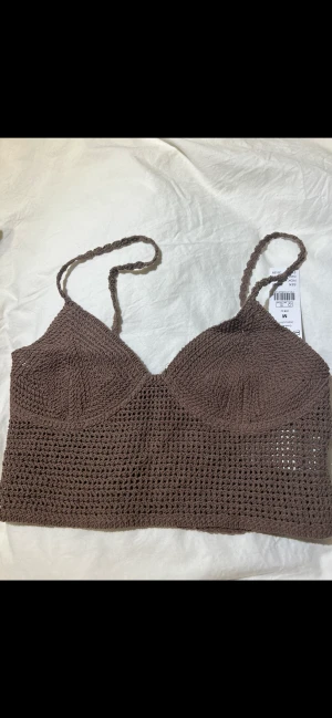 Topp - Säljer en stickad topp