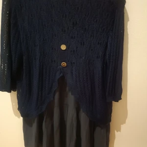 Top - Blue knitted Top is in good condition.