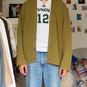 grungy cardigan fits a bit big but i like it. nice green colour fits with nearly everything.