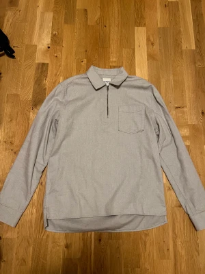 Dobber Half zip  - En half zip tröja. Ny pris 600 kr