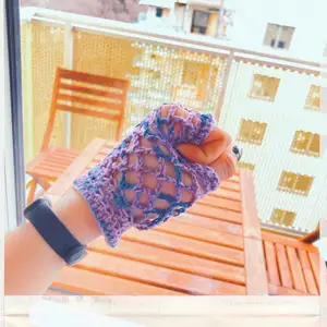 Crocheted fishnet fingerless gloves (colorful edition). Handmade. One size, one color, but can customize it to your needs.  Contact this ad if you want a custom order.  Can make anything!