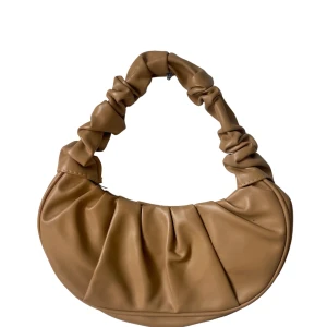 Väska  - Oanvänd liten väska. 30 cm bred 