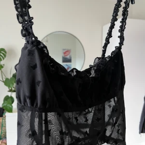 Topp  - Helt ny topp, aldrig använd! Nypris 349kr!