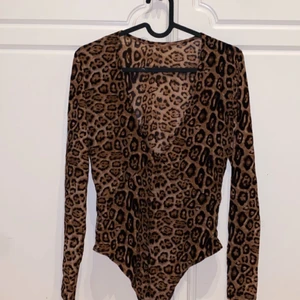 Leopard body - Leopard body, aldrig använd. Storlek M