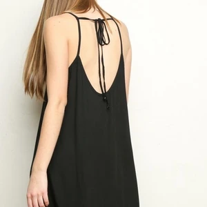 Brandy Melville Belle Grunge Slip Dress - Preloved vintage condition. Some wear and distressing on the fabric which makes this even more of a perfect grunge layering dress. Moleskin fabric slip dress in black with a scoop neck front and back with a back tie detailing. Smoke and pet free storage space. No other flaws to note. Disclaimer: Please expect some general wear in all secondhand pre-owned items as they have lived a previous life, so do not expect a mint item. 