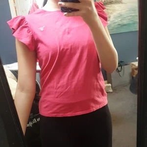 Topp - Volang vid axlarna