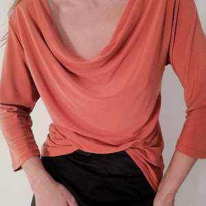 Drape, orange, loose fit if you are small size, and if you are large size will fit even sexier. 