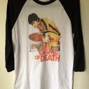 Retro Bruce Lee Game Of Death Baseball T-Shirt Size small, fits like a regular men’s size small.  Excellent condition, no flaws or damage.  DM if you need exact size measurements.   Buyer pays for all shipping costs. All items sent with tracking number.   No swaps, no trades, no offers. 