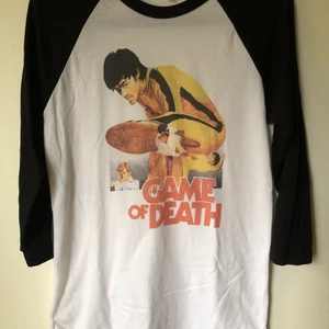 Bruce Lee Game Of Death Baseball Tee - Retro Bruce Lee Game Of Death Baseball T-Shirt Size small, fits like a regular men’s size small.  Excellent condition, no flaws or damage.  DM if you need exact size measurements.   Buyer pays for all shipping costs. All items sent with tracking number.   No swaps, no trades, no offers. 