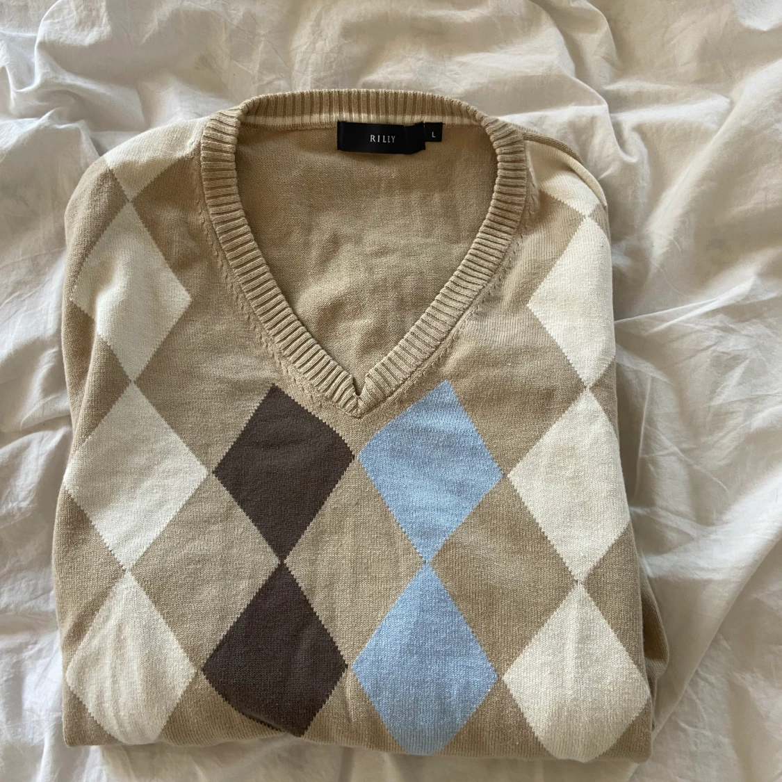 Rutig tröja, storlek L  - 90