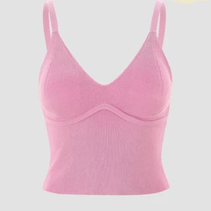 Rosa linne - Supersöt rosa linne med vaddering samt typ bygelliknande band. Slutar ungefär vid höftbenen. Aldrig används säljer pga för stor för mig!