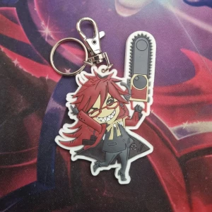 Grell nyckelring - Grell från black butler. Fint skick. Kan mötas upp i vänersborg