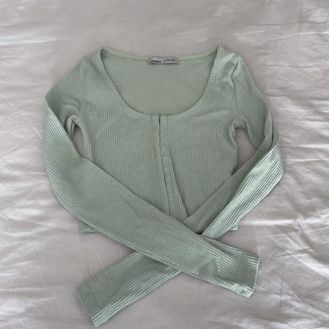 Kort långärmad topp