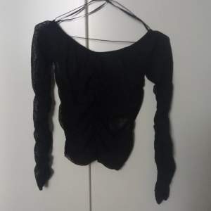 Black ruched mesh top with dots. Size XS. Shipping is not included. 