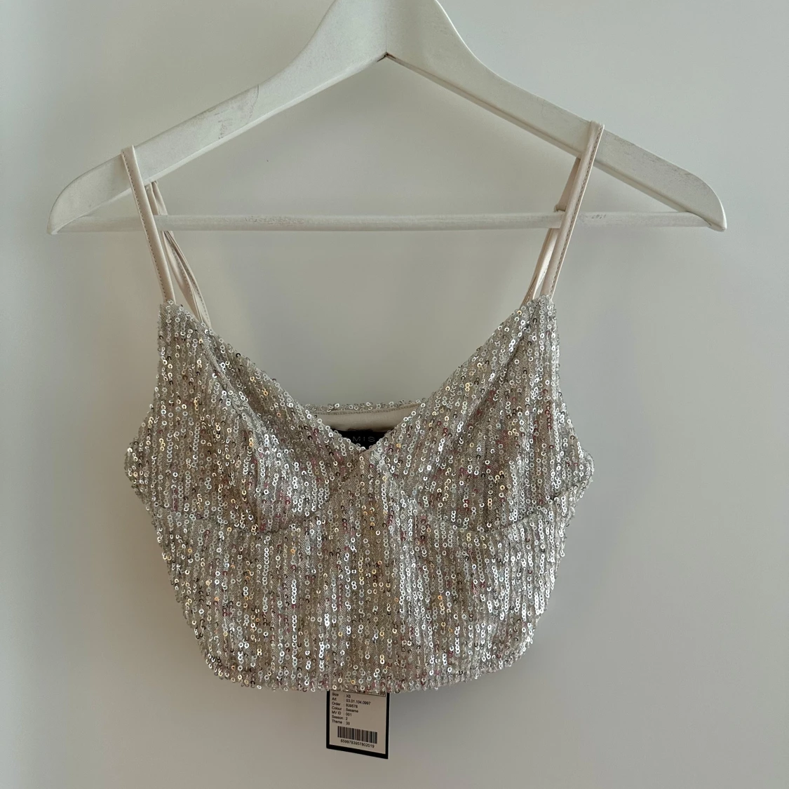 Ny glittertopp med lapp kvar 