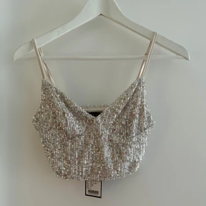 Ny glittertopp med lapp kvar  - Storlek xs