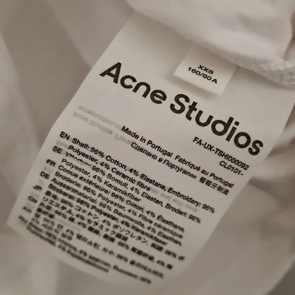 Acne Studios tshirt in white with a yellow 