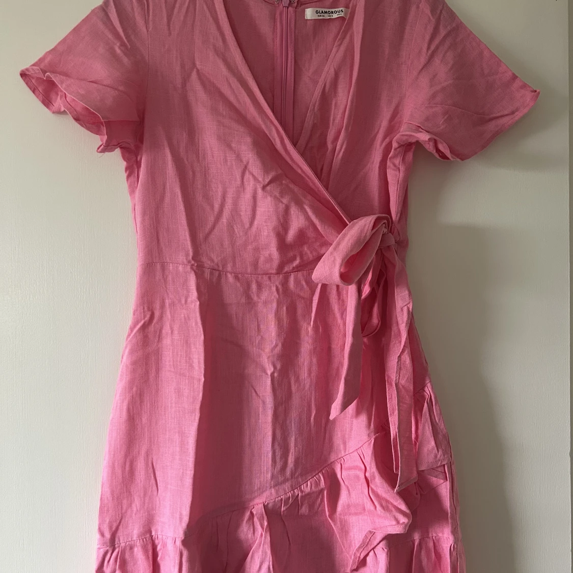 Rosa linnekläderna med knytning