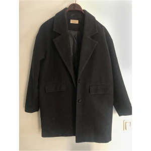 Svart kappa - Svart kappa i storlek 34. 