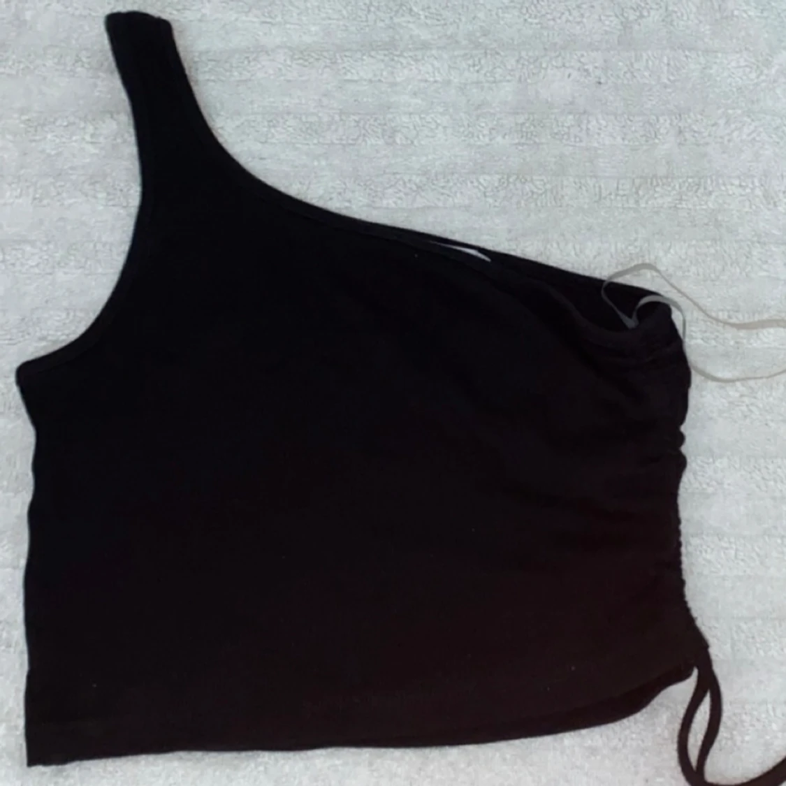 Svar enarmad topp🖤