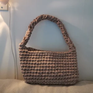 Hand crocheted shoulder bag - Took me a while but I never use it. Study yarn but not the prettiest to be honestly because it one of the first things i made.