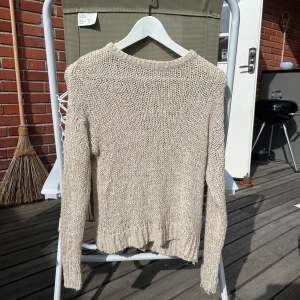 Glittrig tröja - Storlek M