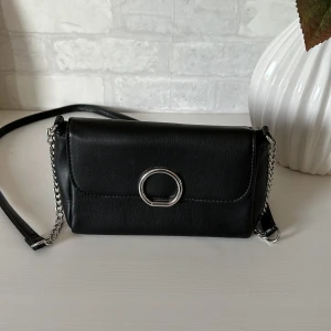 Handväska - Svart liten handväska från glitter