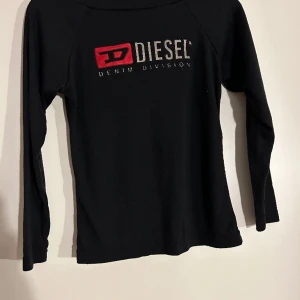 Vintage Disel Shrit - Off shoulder vintage Disel. Reflecting letters in silver. Good condition!