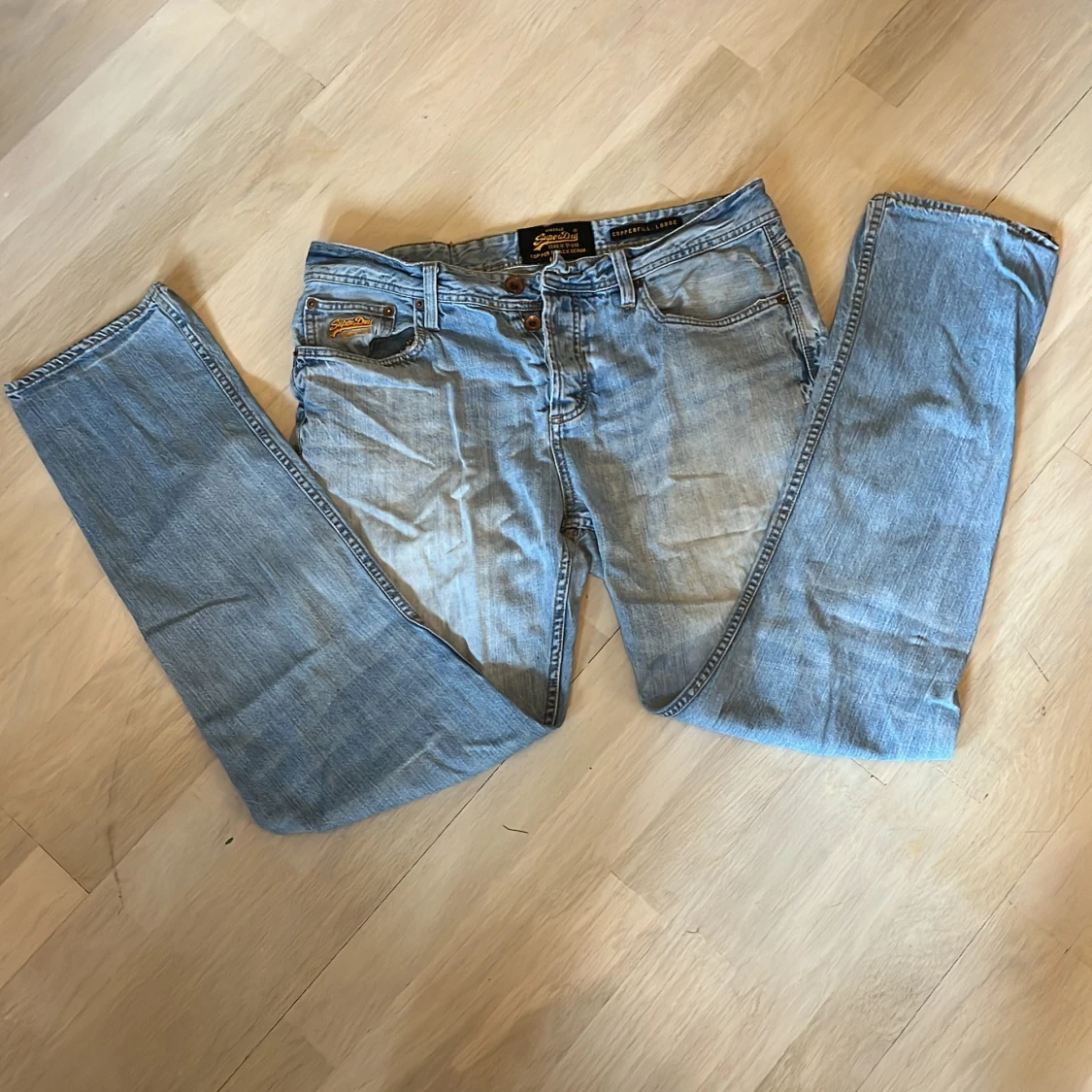 Ljus blåa vintage SuperDry jeans