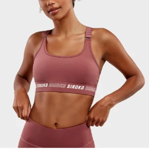 Träningskläder (top + tights) - Nytt set från Siroko. Tights storlek XS och top/bh storlek S. Färgen är rosa/rost. 