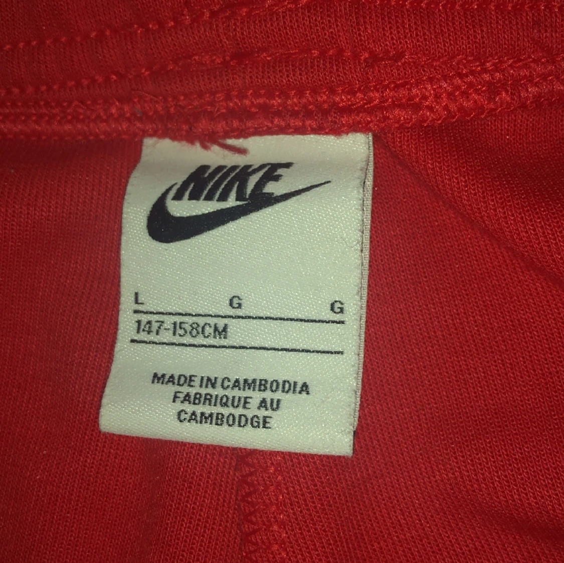 Röda Nike tech byxor  - 90