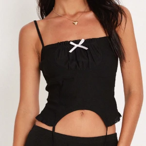 Korsett tröja med rosett - Motel rocks Revonda corset tröja köpt på urban outfitters, säljer för att jag bytt stil