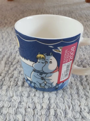 Muminmugg Vinterbrasa Mumin  - Felfri mugg med etikett kvar. Säljer fler Muminmuggar så kika gärna också på mina övriga annonser. Packar mycket noggrant. 