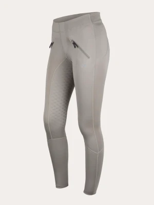 Beige ridleggings från Uhip - Snygga beige ridleggings från Uhip med hög midja och två dragkedjefickor framtill. Stretchigt material som sitter tight och bekvämt, med grepp på insidan av benen för extra stöd vid ridning. Perfekta för dig som vill ha både stil och funktion i stallet.
