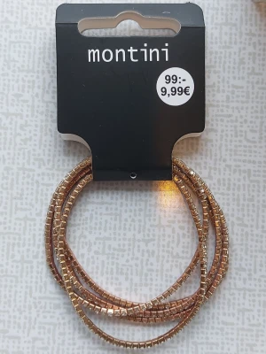 Guldigt armband från Montini - 5 stycken armband från Montini i guld.  Användna några gånger, guld färgen bleknat men alla diamanter finns kvar! 