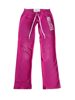 Vintage pink Hollister low waisted bootcut sweatpants  - Cute vintage sweatpants from Hollister!! They’re low waisted and bootcut! They’re a size XS. There’s some wear on the knees but that’s not that visible and a minor stain on the draw string. Other than that they’re in good condition and super cute! Selling them because they’re unfortunately too small for me :(( 