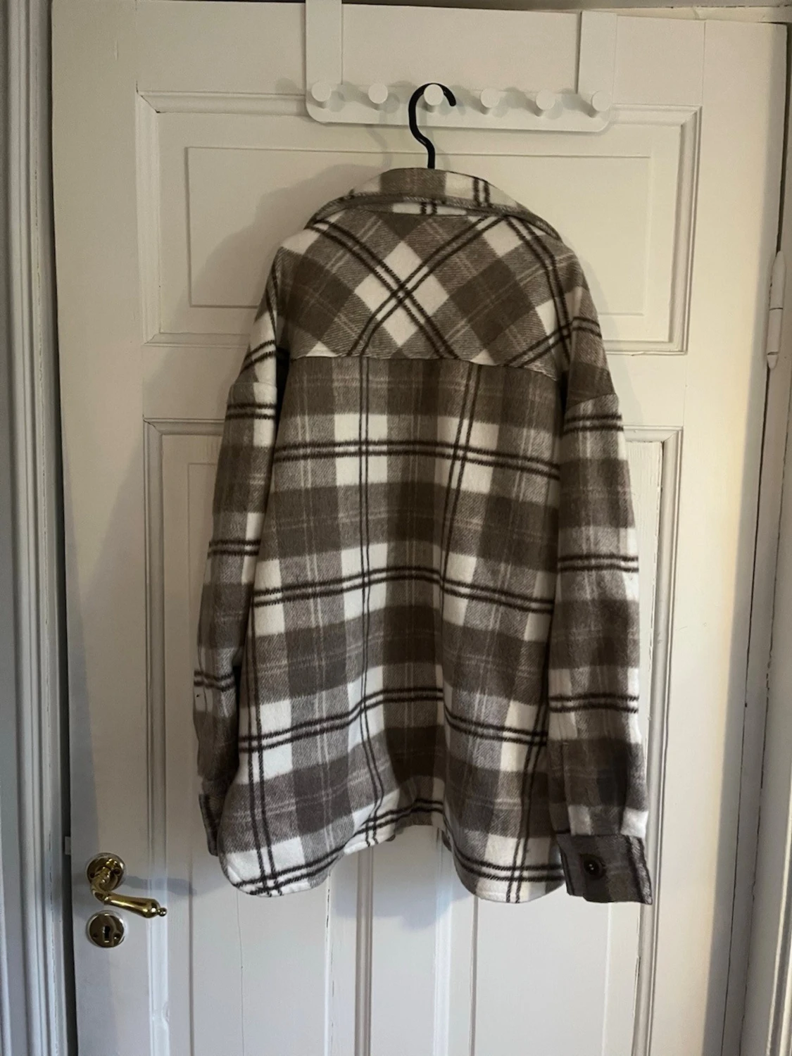 Rutig beige och vit kappa från H&M