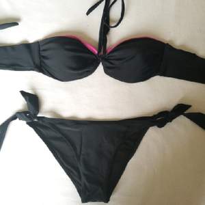 A nice swimsuit, bra has a double face (black with a small pink strip and a pink face with a small black band)